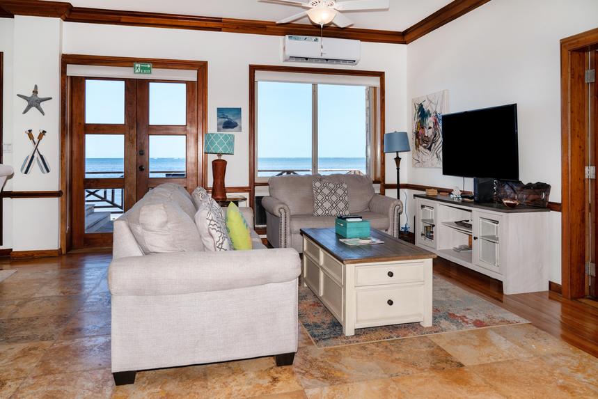 Spacious living room with comfortable seating, stylish décor, and an inviting gathering space.
