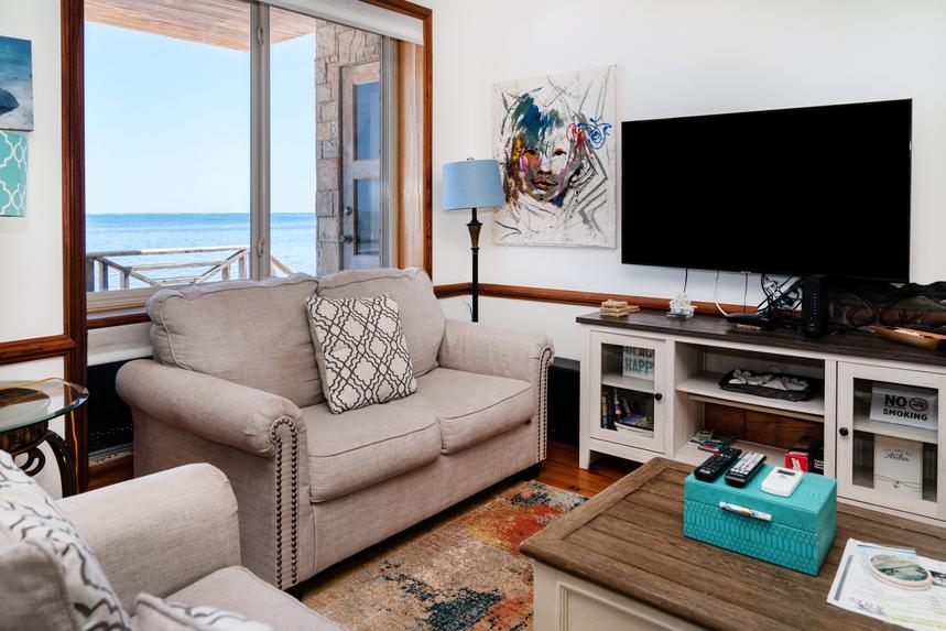 Spacious living room with comfortable seating, stylish décor, and an inviting gathering space.