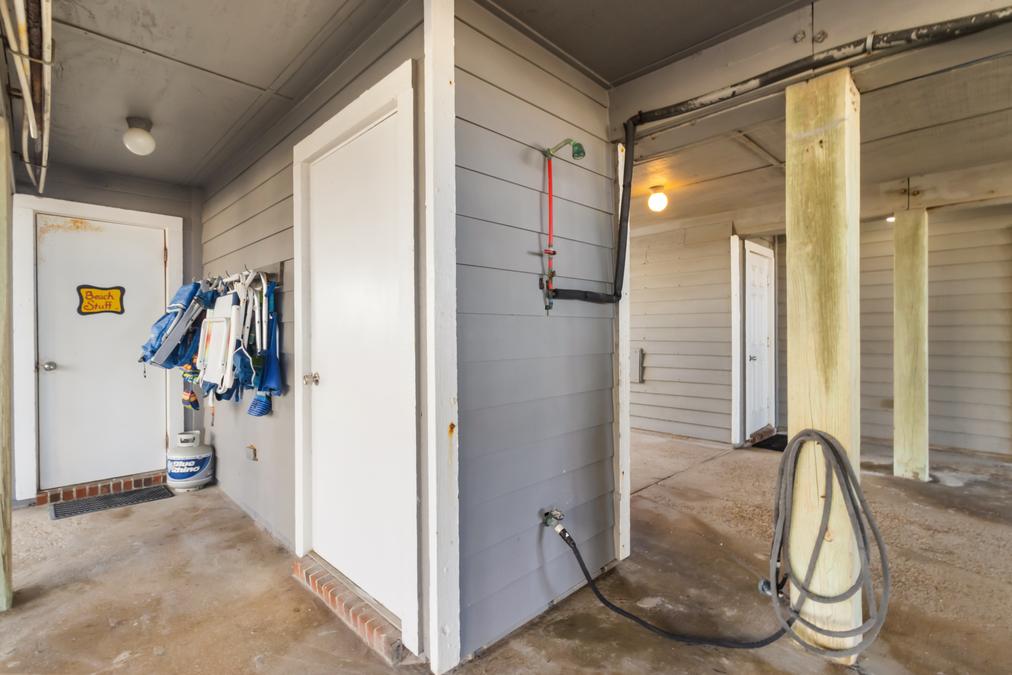 2 Car Covered Carport with Stocked Beach Closet and Outdoor Shower