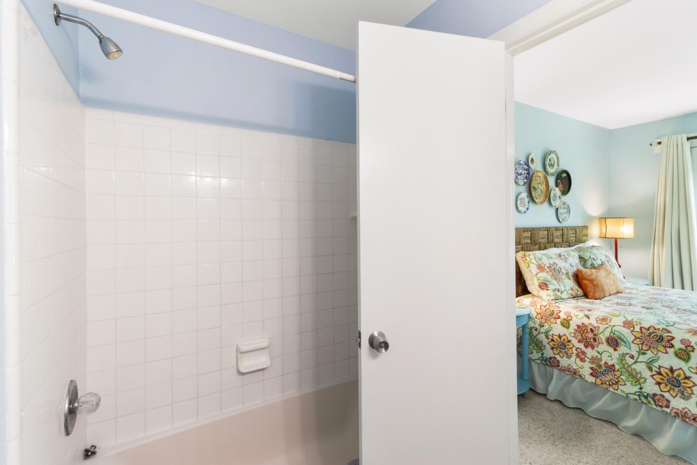 Looking from your spacious guest bath into the room