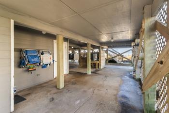 2 Car Covered Carport with Stocked Beach Closet and Outdoor Shower