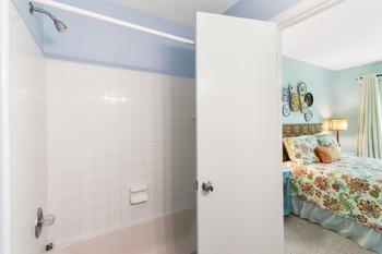 Looking from your spacious guest bath into the room