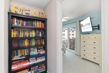 Well-stocked bookshelf with entertainment and games galore!
