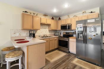 Updated stainless steel appliances in convenient kitchen