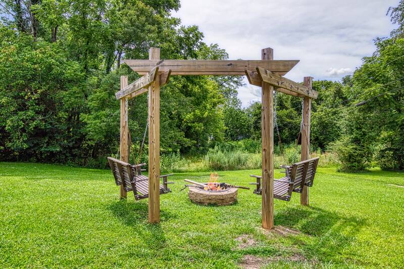 Rustic Acres fire pit with swing