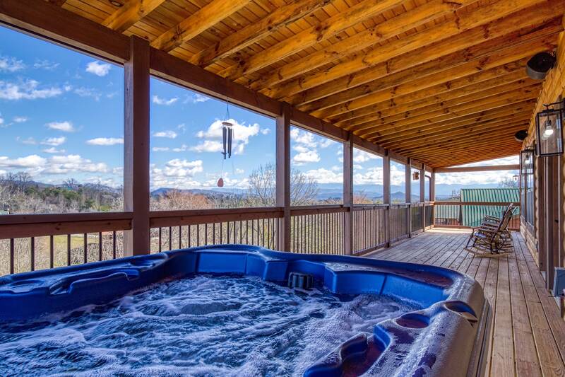 Cozy Cub Cabin hot tub with mountain view