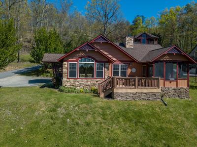 Sunset View Chalet open side deck with table and chairs