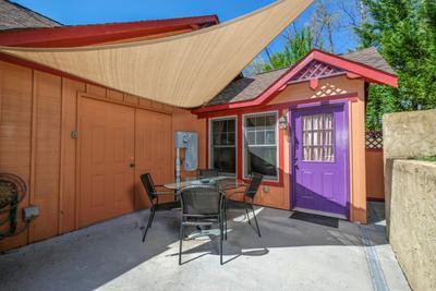 Sunset View Chalet shaded side patio with table and chairs