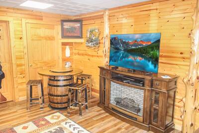 Creekside Lodge lower level multipurpose room with year round electric fireplace