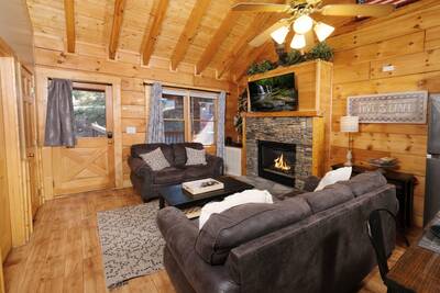 Angler's Bend living room with gas fireplace and 50-inch TV