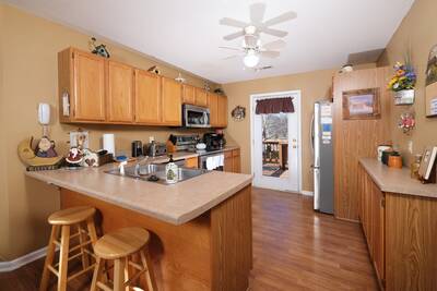 Pigeon River Retreat bar area with fully furnished kitchen with stainless steel appliances