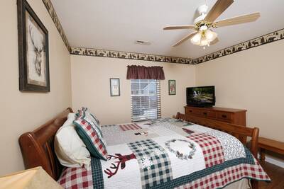 Pigeon River Retreat bedroom one with 32-inch flat screen TV