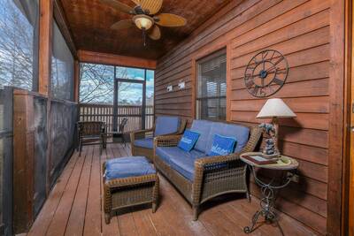 Black Bear Lodge - Screened in entry deck with wicker furniture
