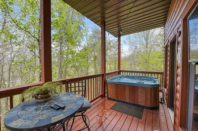The Playful Bear lower level deck with hot tub