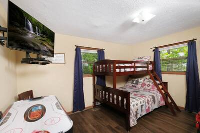 Moose Haven Cabin - Bedroom 2 with twin over full bunk bed and air hockey table
