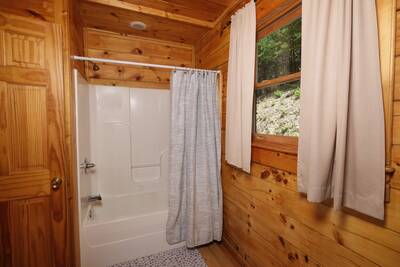 Katies Lodge main level bathroom 1 with tub/shower combo