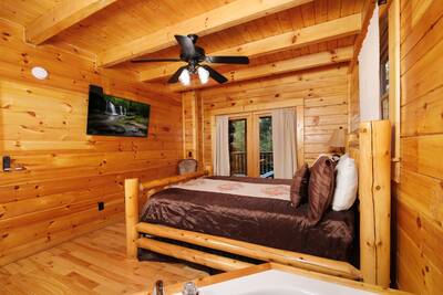 Katies Lodge main level bedroom 2 with 50-inch flat screen TV