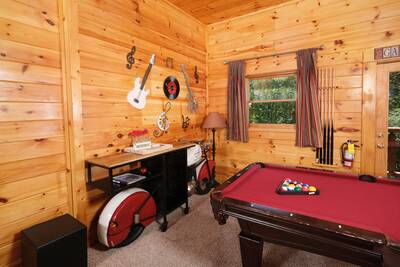 Katies Lodge lower level game room with motorcycle bar