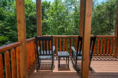 Katies Lodge lower level back deck with rocking chairs