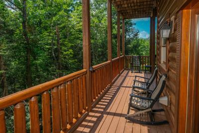 Katies Lodge lower level back deck with rocking chairs