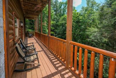 Katies Lodge lower level back deck with rocking chairs
