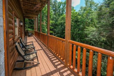 Katies Lodge lower level back deck with rocking chairs