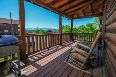 View to Remember wraparound covered deck with rocking chairs