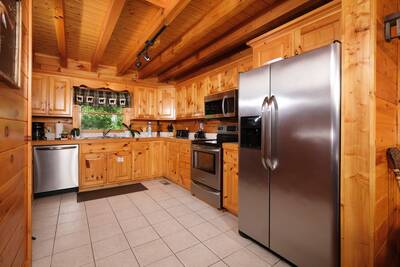 View to Remember fully furnished kitchen with stainless steel appliances
