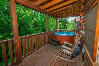 View to Remember wraparound covered main level deck with hot tub