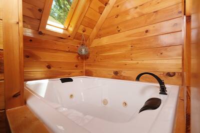Treeside upper level bedroom 2 with in-room whirlpool tub