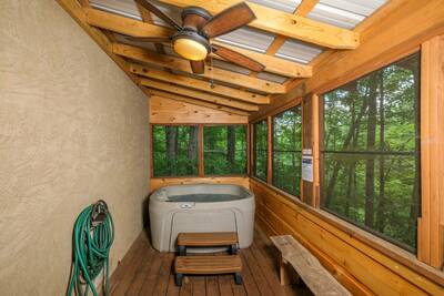 Treeside lower level screened in back deck with hot tub