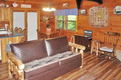 The Cabin at SunRae Ridge living room with futon
