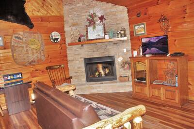 The Cabin at SunRae Ridge living room with gas fireplace