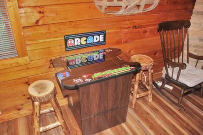 The Cabin at SunRae Ridge arcade game with stools