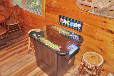 The Cabin at SunRae Ridge living room with arcade game