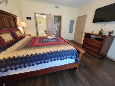 Pigeon Forge Condo Getaway - Bedroom with 50-inch TV