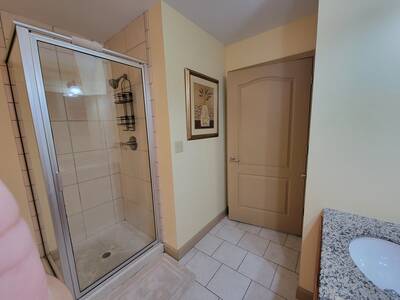 Pigeon Forge Condo Getaway - Master bathroom with walk in shower