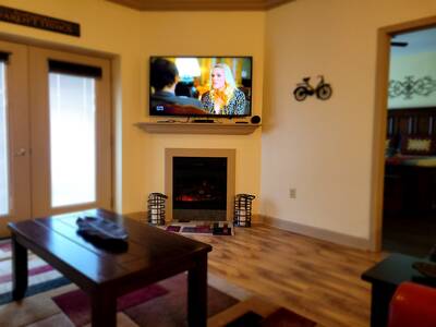 Pigeon Forge Condo Getaway - Living room with 55-inch TV