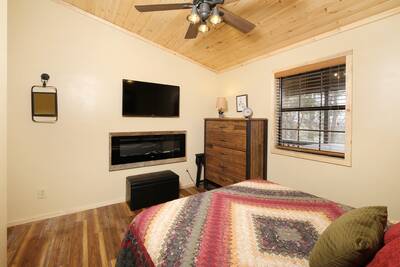 Margaritas at Sunrise - Bedroom with queen bed, year round electric fireplace, and 43-inch flat screen TV
