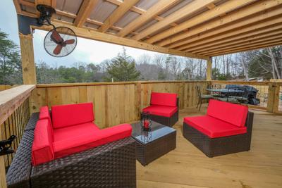 Margaritas at Sunrise - Covered back deck with wicker furniture