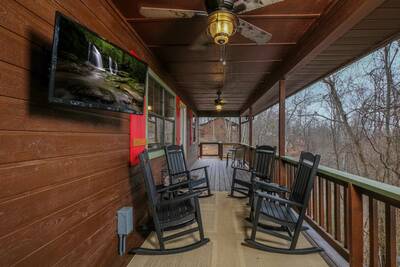 Margaritas at Sunrise - Covered front deck with rocking chairs and 32-inch TV