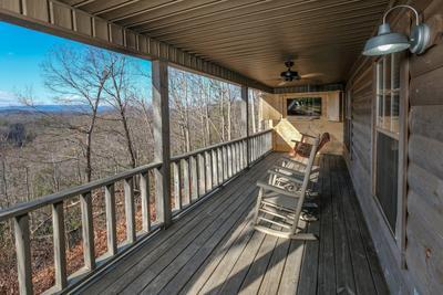 The Hidden End covered deck with rocking chairs