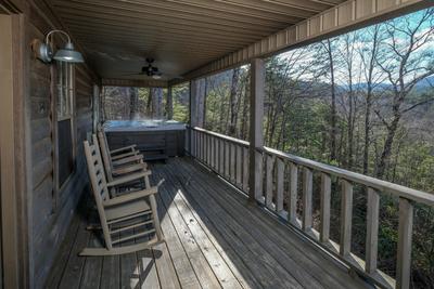 The Hidden End covered back deck with hot tub