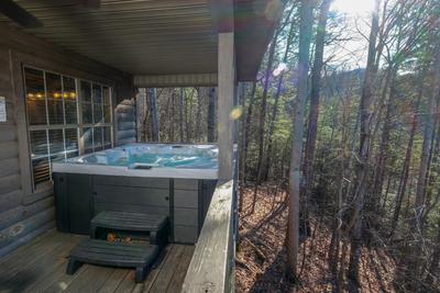 The Hidden End covered back deck with hot tub