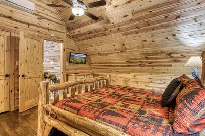 A Mountain Hideaway Lodge - Upper level bedroom with king size bed and 39-inch flat screen TV