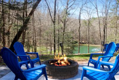 Water's View fire pit overlooking the community fishing pond