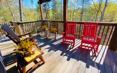 A Mountain Hideaway Lodge - Covered back deck with rocking chairs