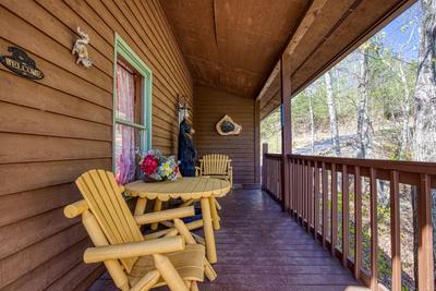 Emerald Forest - Covered entry deck with table and chairs