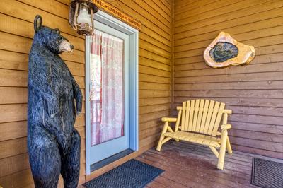 Emerald Forest - Covered entryway with bear statue