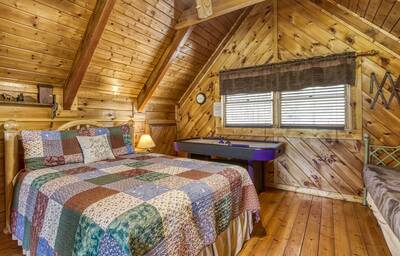 Sweet Dreams loft area bedroom with air hockey table